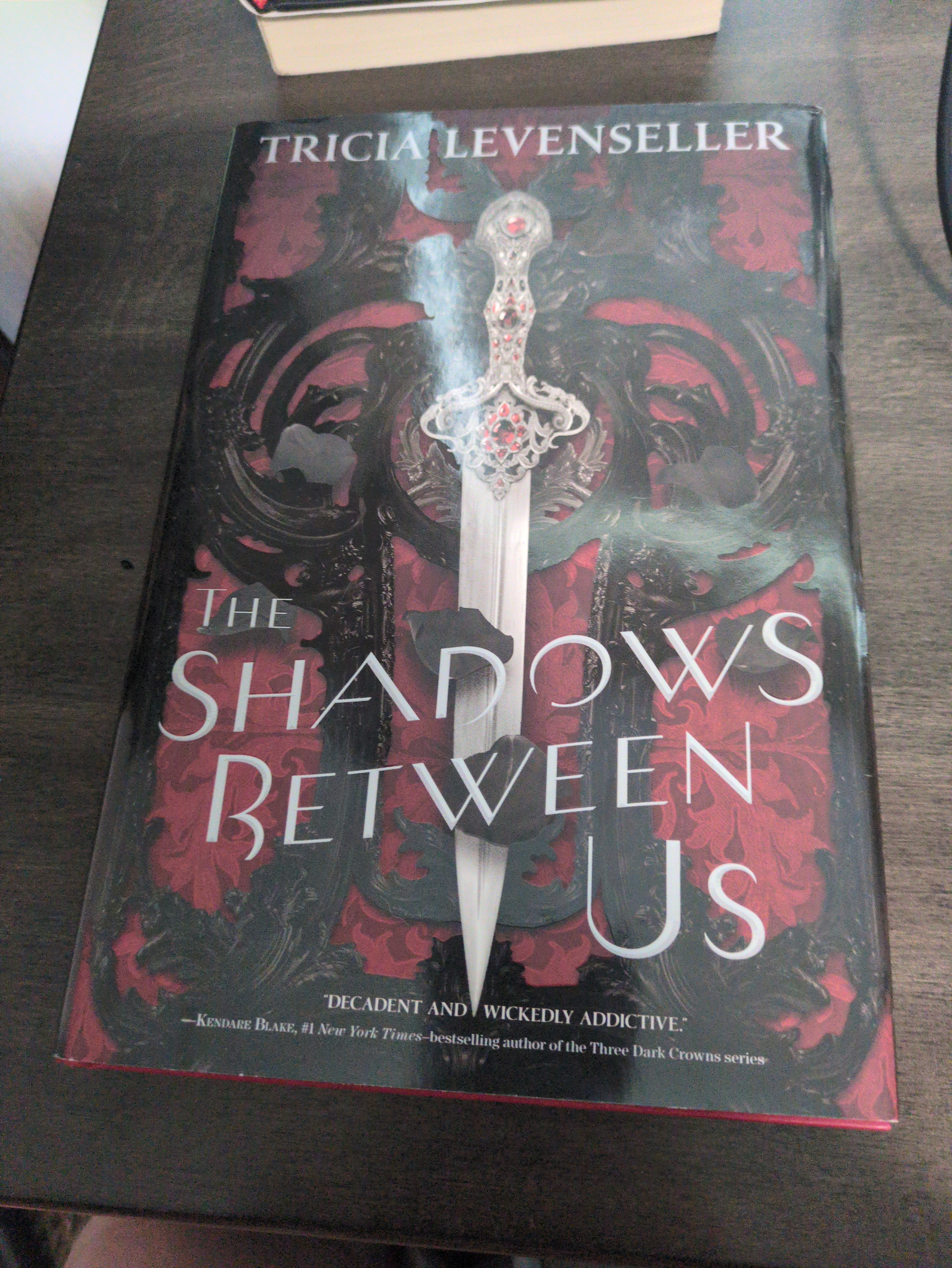 Cover of The Shadows Between Us